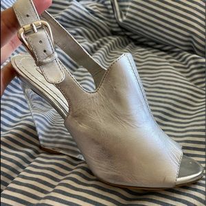 Nine West heels are comfortable, ‘06. They’re  scuffed, but the silver has sheen